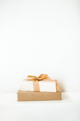 Christmas / New Year gift boxes with bows. Traditional winter holidays gifts packaging creative concept.