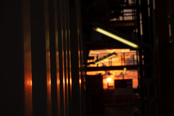 White steel wall under orange sunrise