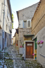 The road between the old houses of a village in the mountains of southern Italy