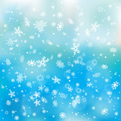 closeup snowfall on blue sky backdrop
