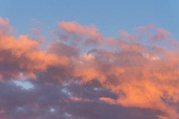 Amazing cloudscape with sunset sky. Colour background.