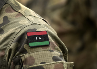 Flag of Libya on military uniform. Army, soldiers, Africa (collage).