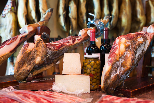 jerked iberic jammon of bacon with wine, cheese and olives