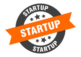 startup sign. startup orange-black round ribbon sticker