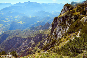 Obraz premium Mountain landscape in Austria, cloudy, forests, rocks, city in the mountains, summer
