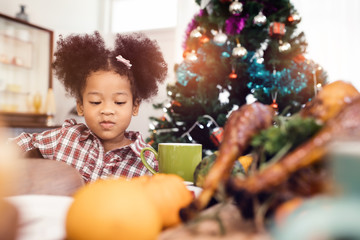 Little Girl Eating  and smile Thanksgiving Celebration Concept.Merry Christmas and Happy Holiday. Cute little child girl smile.