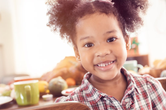 Little Girl Eating  And Smile Thanksgiving Celebration Concept.Merry Christmas And Happy Holiday. Cute Little Child Girl Smile.