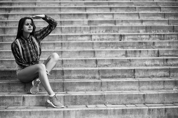 Girl in a clown makeup black and white