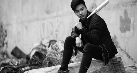 Black White photo of Asian young man outdoors posing