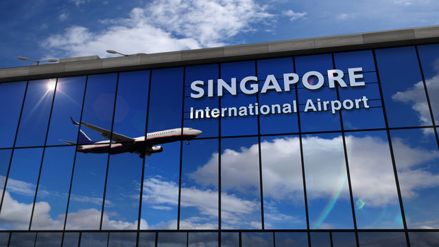 Airplane landing at Singapore mirrored in terminal