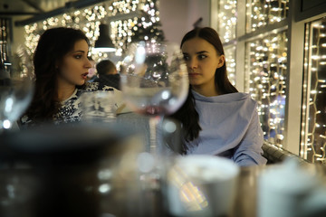 The girl in the evening rest in a cafe