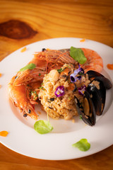 A Plate of Italian Seafood Risotto With Prawn and Clams