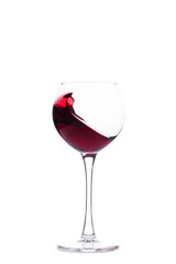 a glass with red wine, a drink in motion, an advertising concept
