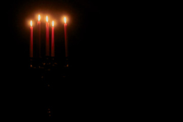 Five red candles in the dark