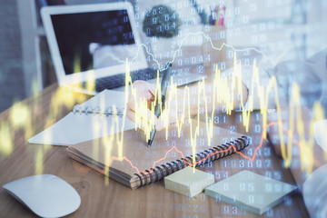 Financial charts displayed on woman's hand taking notes background. Concept of research. Double exposure