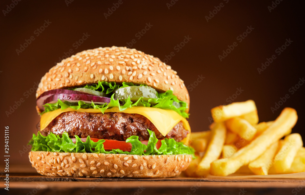 Wall mural burger and french fries on wooden table