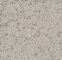 Vue macro d'une texture de sable blanc avec gravillons