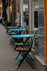 Fototapeta na wymiar chairs and tables outside a cafe