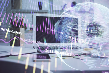 Financial graph colorful drawing and table with computer on background. Double exposure. Concept of international markets.