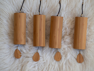 Koshi chimes sound therapy instrument on a sheep fur