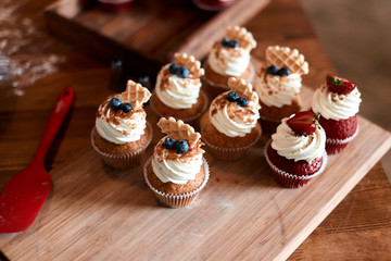 woman has prepared yummy cupcakes for sale, dicount, business, close up cropped photo