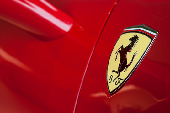 Mulhouse - France - 5 October 2019 - Closeup of Ferrari logo on red sport car in ferrari retailer showroom