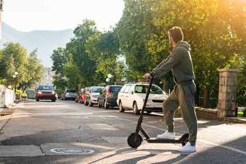 A man with electric scooter on the street