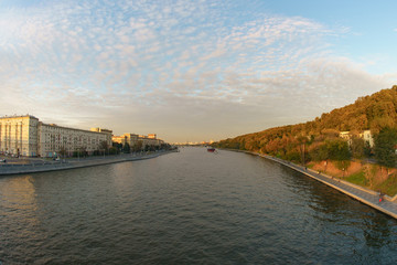 Autumn in the city. Photography of Moskva river and city. Public park become yellow. View from above.  