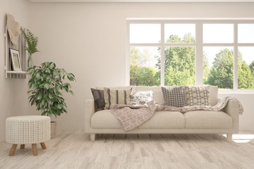 Stylish room in white color with sofa and summer landscape in window. Scandinavian interior design. 3D illustration