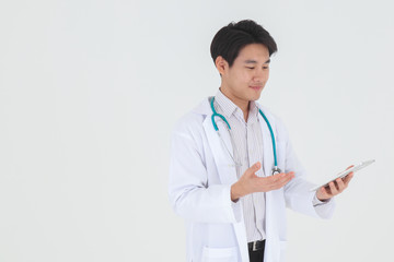 Fototapeta premium Portrait of young Asian happy and smile male medical doctor with stethoscop