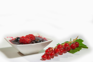 Raspberry and currant berries in jam