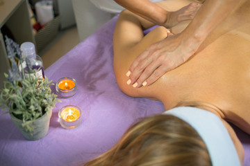 Female relaxing back massage with hands. Beauty body skin care treatment concept.