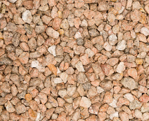 Vue gros plan d'une texture de pierre, gravier et sable fin rose et blanc