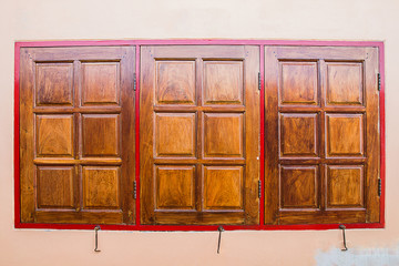 three wooden window  in home is  closed