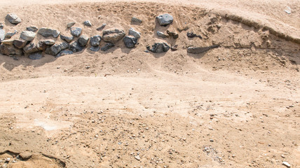 Sand and stones on the sand beach.