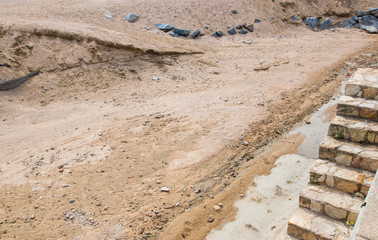 Sand and stones on the building.