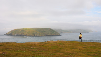 Fototapeta na wymiar Looking Across t a Misty Skomer Island from the Welsh Coast