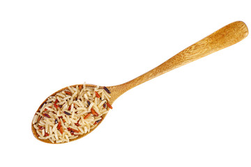 Wooden spoon with dried rice grains of different breeds