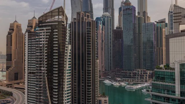 View of various skyscrapers and towers in Dubai Marina from above aerial timelapse. Modern buildings in urban skyline