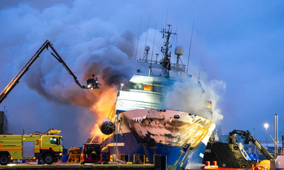 Tromso, Norway 25.09.2019 A Russian fishing trawler named "Bukhta Nayezdnik" which caught fire in Norway on Wednesday has overturned and is mostly
