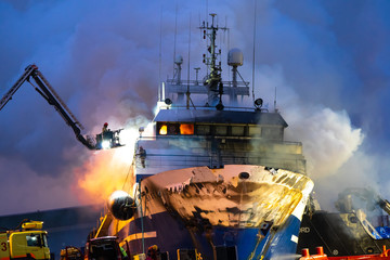 Tromso, Norway 25.09.2019 A Russian fishing trawler named "Bukhta Nayezdnik" which caught fire in Norway on Wednesday has overturned and is mostly submerged.