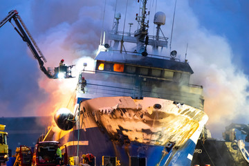 Tromso, Norway 25.09.2019 A Russian fishing trawler named "Bukhta Nayezdnik" which caught fire in Norway on Wednesday has overturned and is mostly submerged.