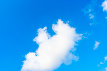 Nature Bright blue Sky with white clouds on blackground. Beautiful sky and clouds in the afternoon.