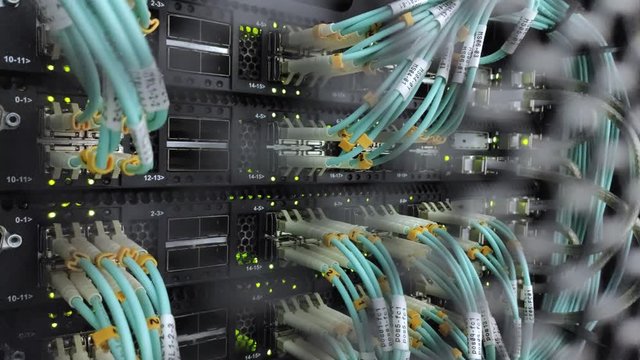 Optical fiber. Severs computer in a rack at the large data center. The video contains noise.