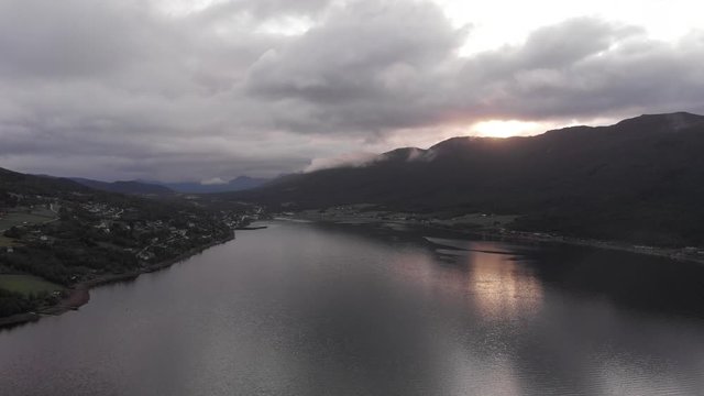 Aerial flying over a lake, beautiful mountains landscape in Eidsvåg, Norway.