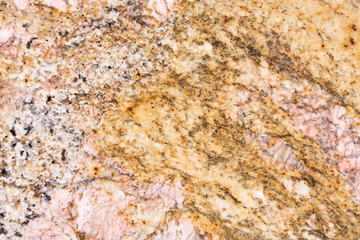 Texture of golden granite stone.