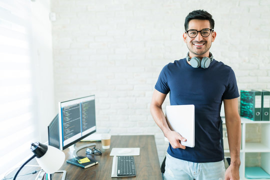 Hispanic Male Freelance Programmer Working At Home