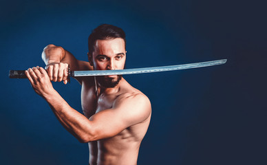 Ninja samurai warrior with naked torso in attack pose with katana sword © Dmytro