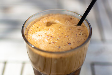 Traditional greek cold coffee Frappe made from water, instant coffee and ice cubes