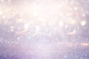 abstract glitter pink, purple and gold lights background. de-focused